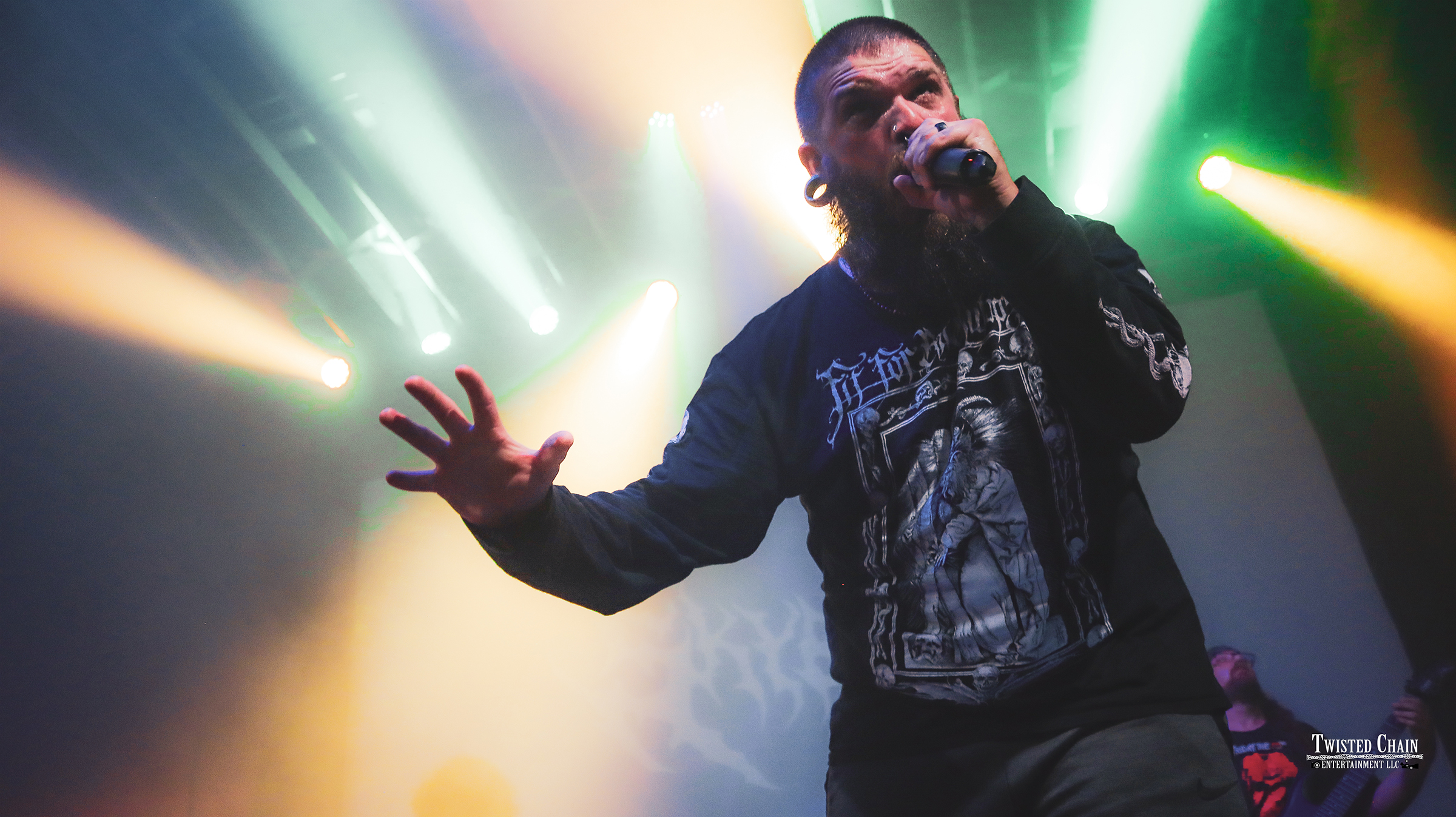 Live concert performance with dramatic lighting